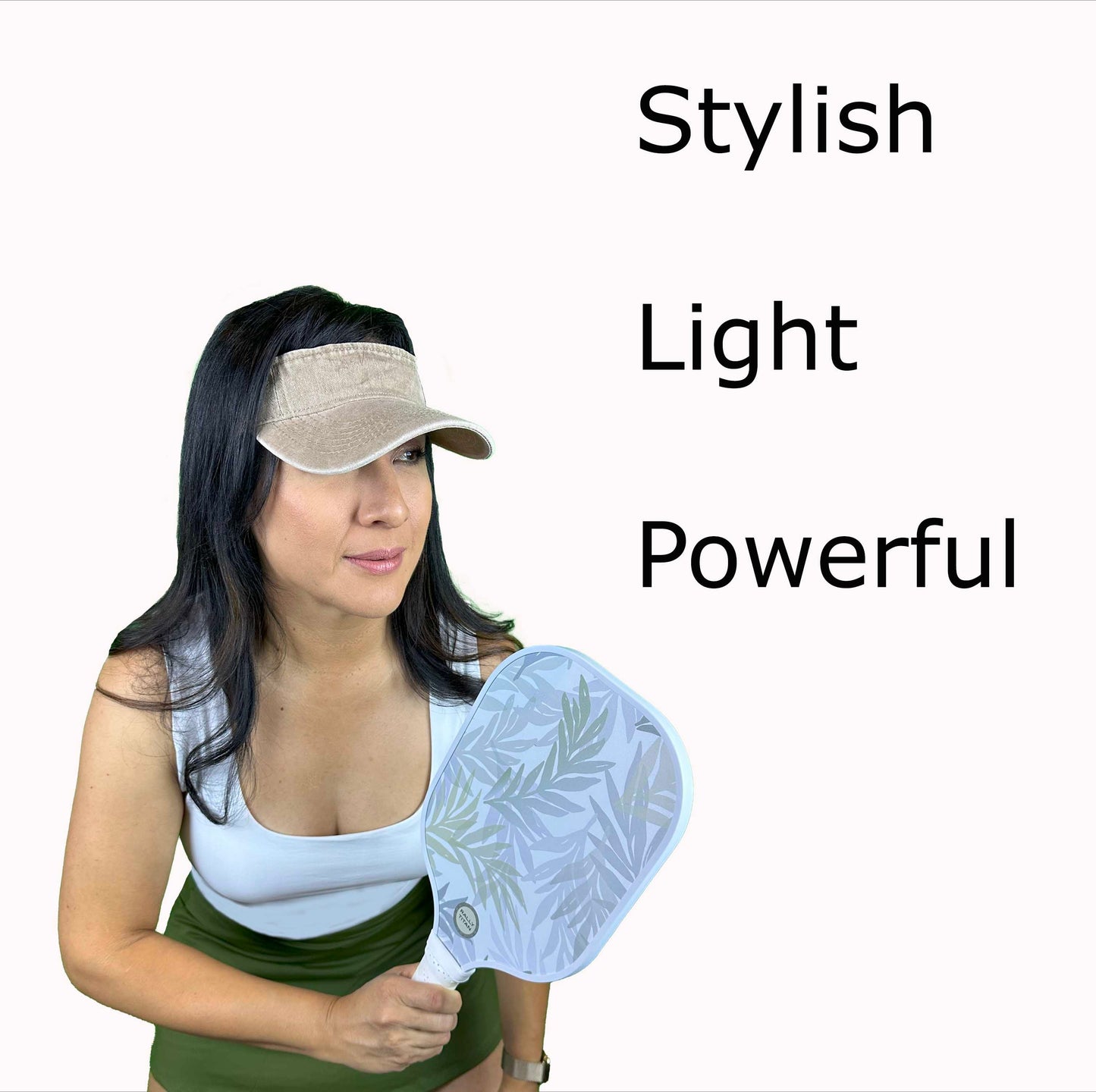 A woman in a beige visor and white tank top holds the Rally Titan Pickleball Olive B paddle featuring a T300 textured carbon fiber surface. Bold black text at right reads "Stylish, Light, Powerful" on a plain white background.
