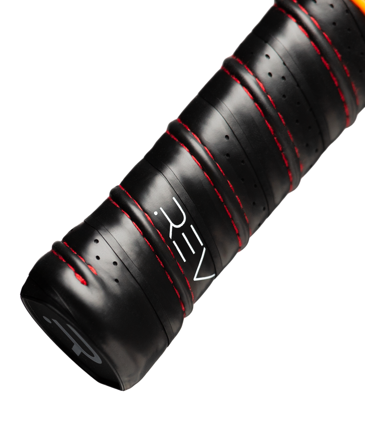 A close-up of the black handle on the NEBULA Pickleball Paddle by REV Pickleball, a lightweight paddle ideal for beginners.