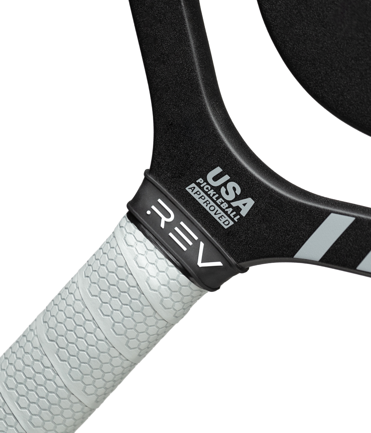 Close-up of the REV Pickleball PLATINUM Paddle handle with a white hexagon-patterned grip. The black, edgeless paddle features USA Pickleball Approved and REV logos near the handle, shown against a plain white background.