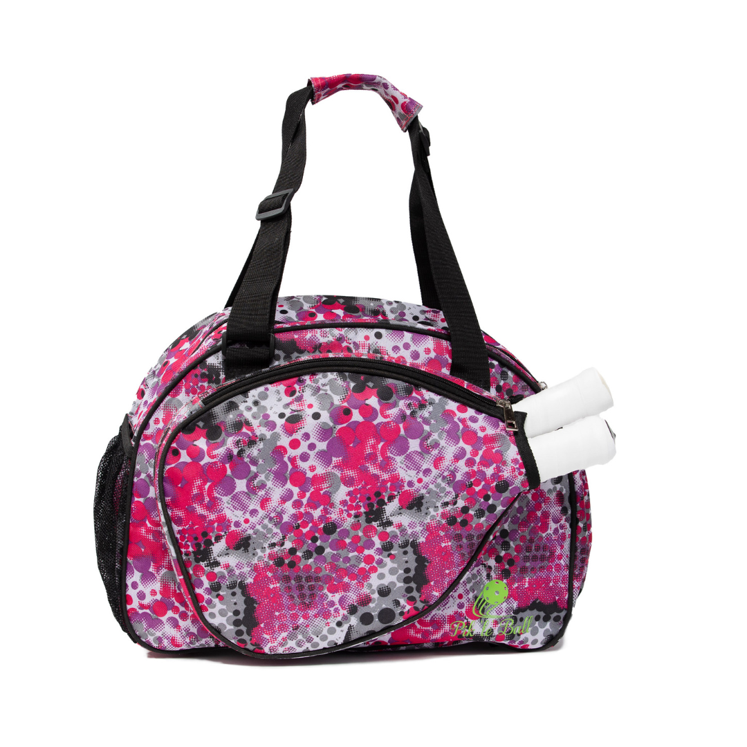 The Pik'le'Ball Sports Stylish Stripe Premium Women's Pickleball Bag features organizer pockets, a carry strap, and a chic pink, black, and white abstract pattern with a small green cartoon turtle on the lower right side.