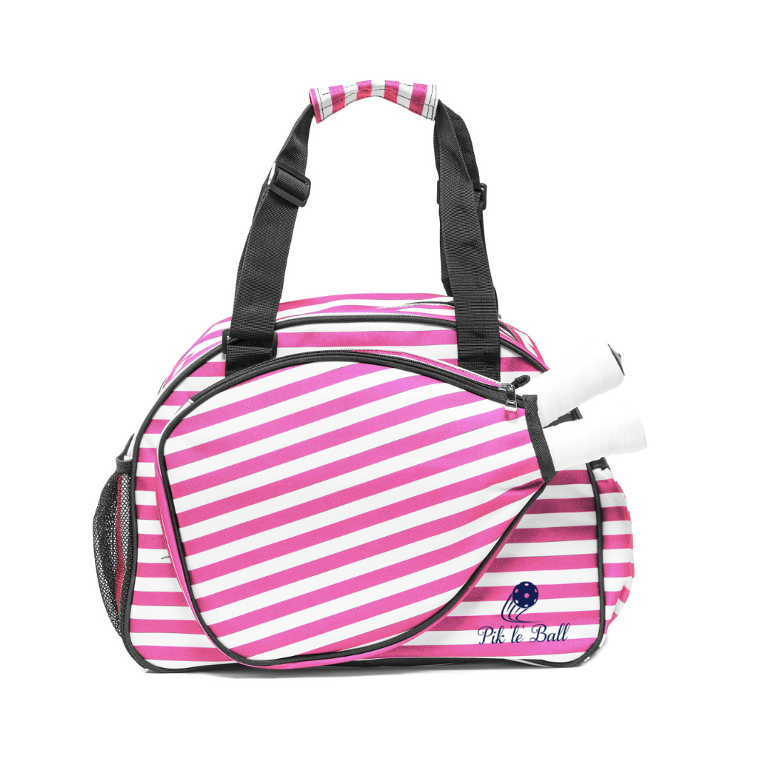 The Pik'le'Ball Sports Stylish Stripe Premium Women's Pickleball Bag features pink and white stripes, black accents, roomy compartments, a paddle-shaped side pocket for two paddles, mesh pocket, organizer pockets, carry strap, and a “PickleBall” logo.