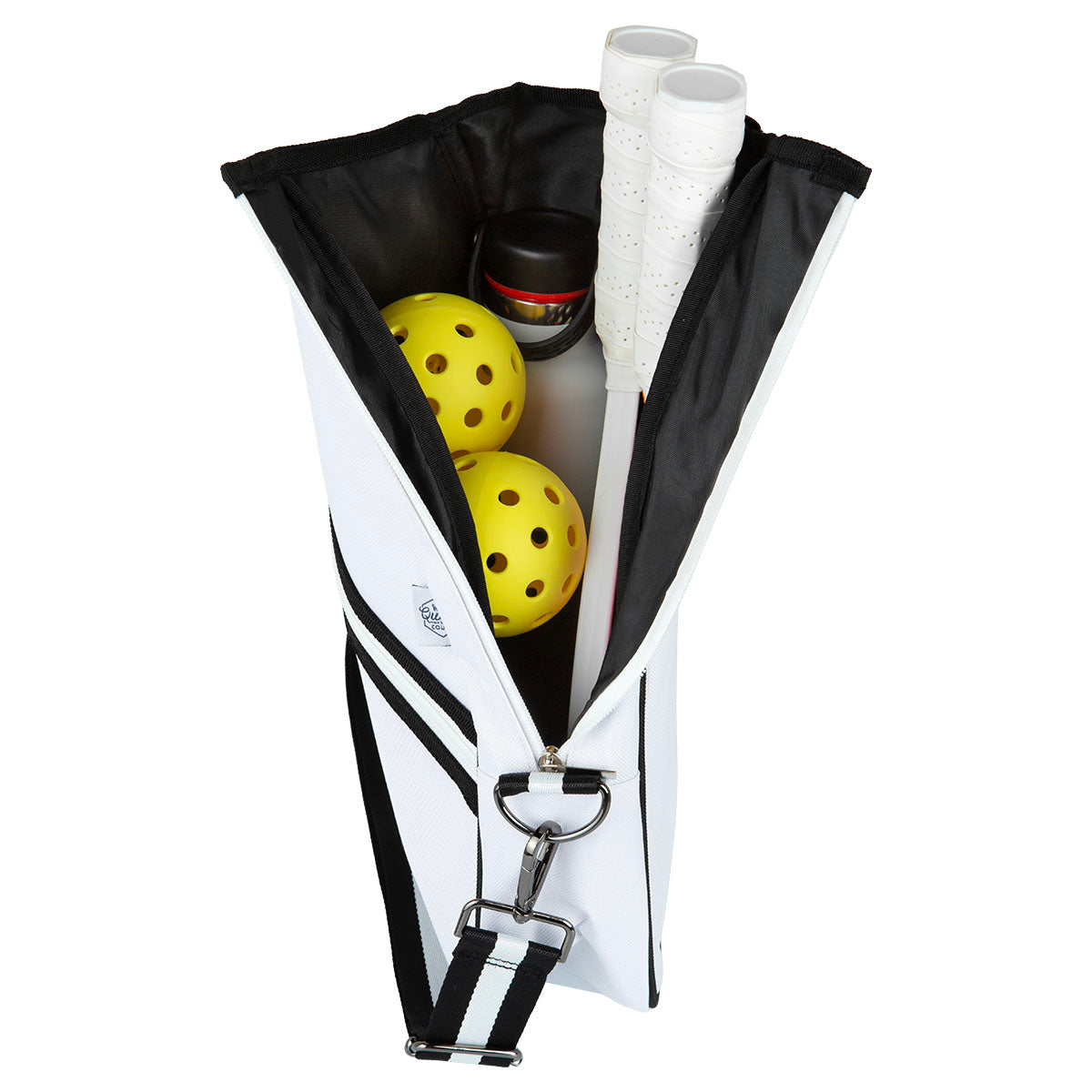 The Queen of the Court Essentials Pickleball Bag, shown open, displays two yellow pickleballs, two white-handled racquets, and a black container inside. An adjustable strap and metal clip are visible with gear neatly arranged upright.