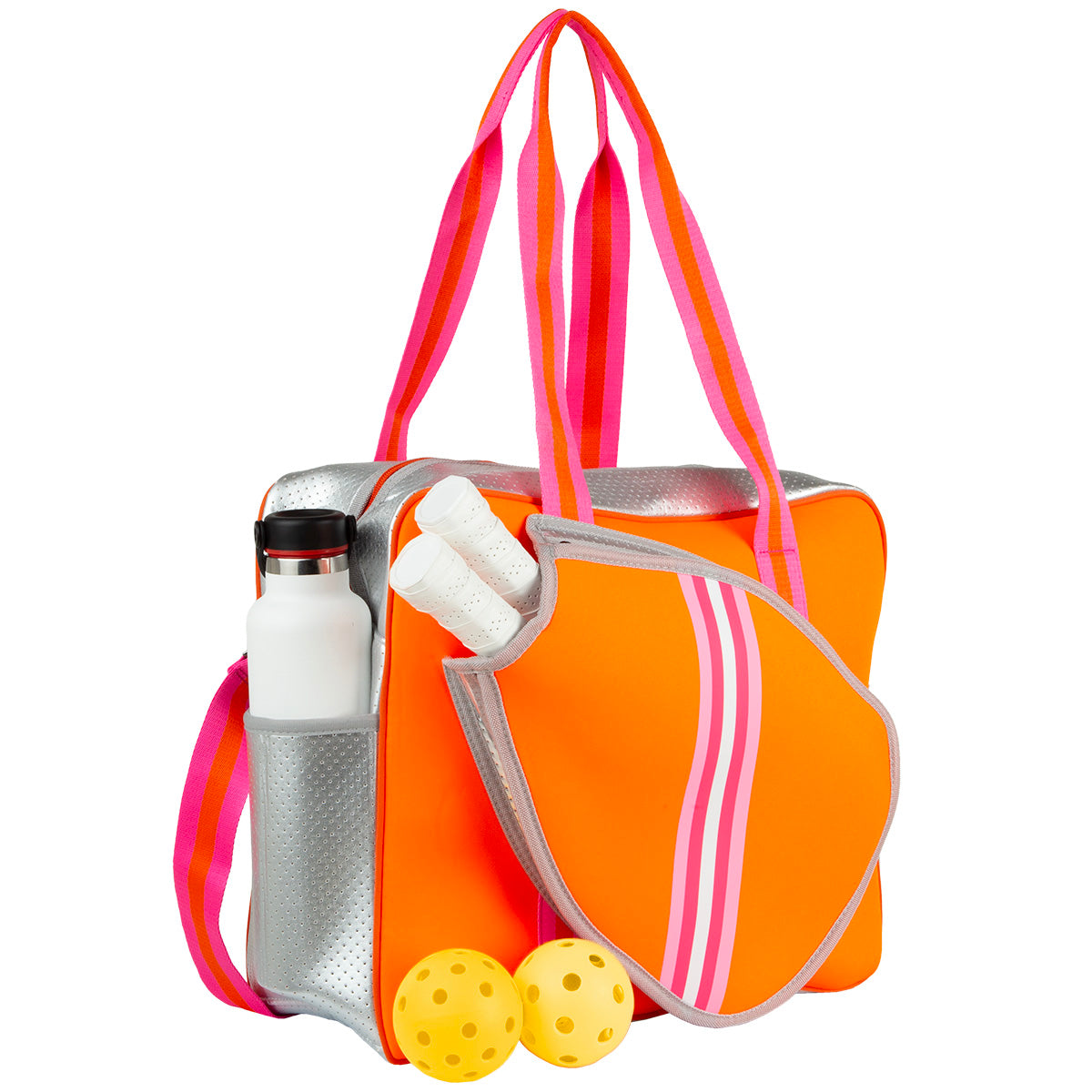 The Queen of the Court Brooklyn Pickleball Bag is bright orange neoprene with pink and red striped handles, silver trim, a paddle-shaped pocket, holds two white grips and a water bottle, with two yellow pickleballs beside it.