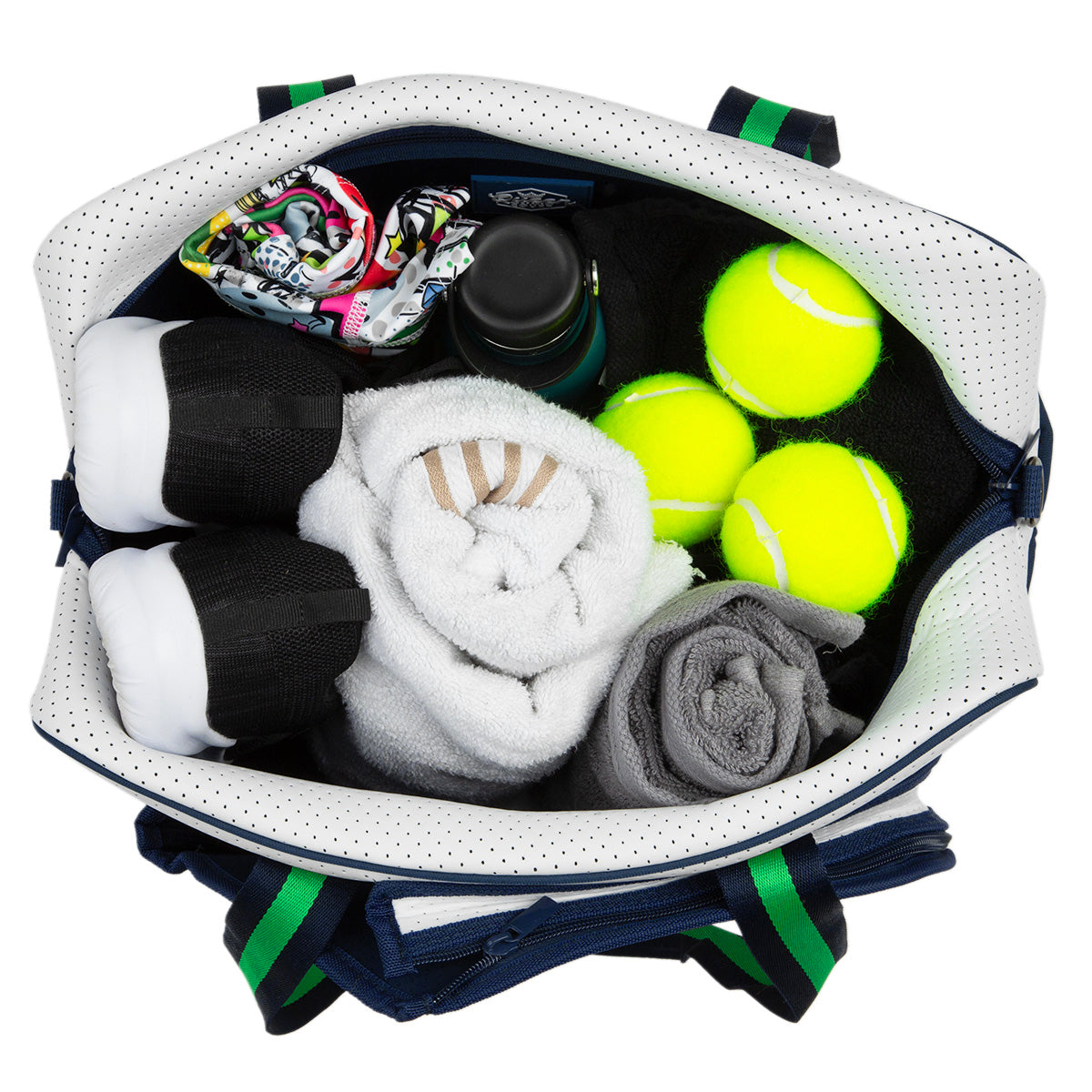 The Queen of the Court Hampton Tennis Bag, seen from above, holds three tennis balls, two rolled towels, black-and-white athletic shoes, a printed fabric item, a water bottle, and a gray rolled piece of clothing arranged neatly inside.