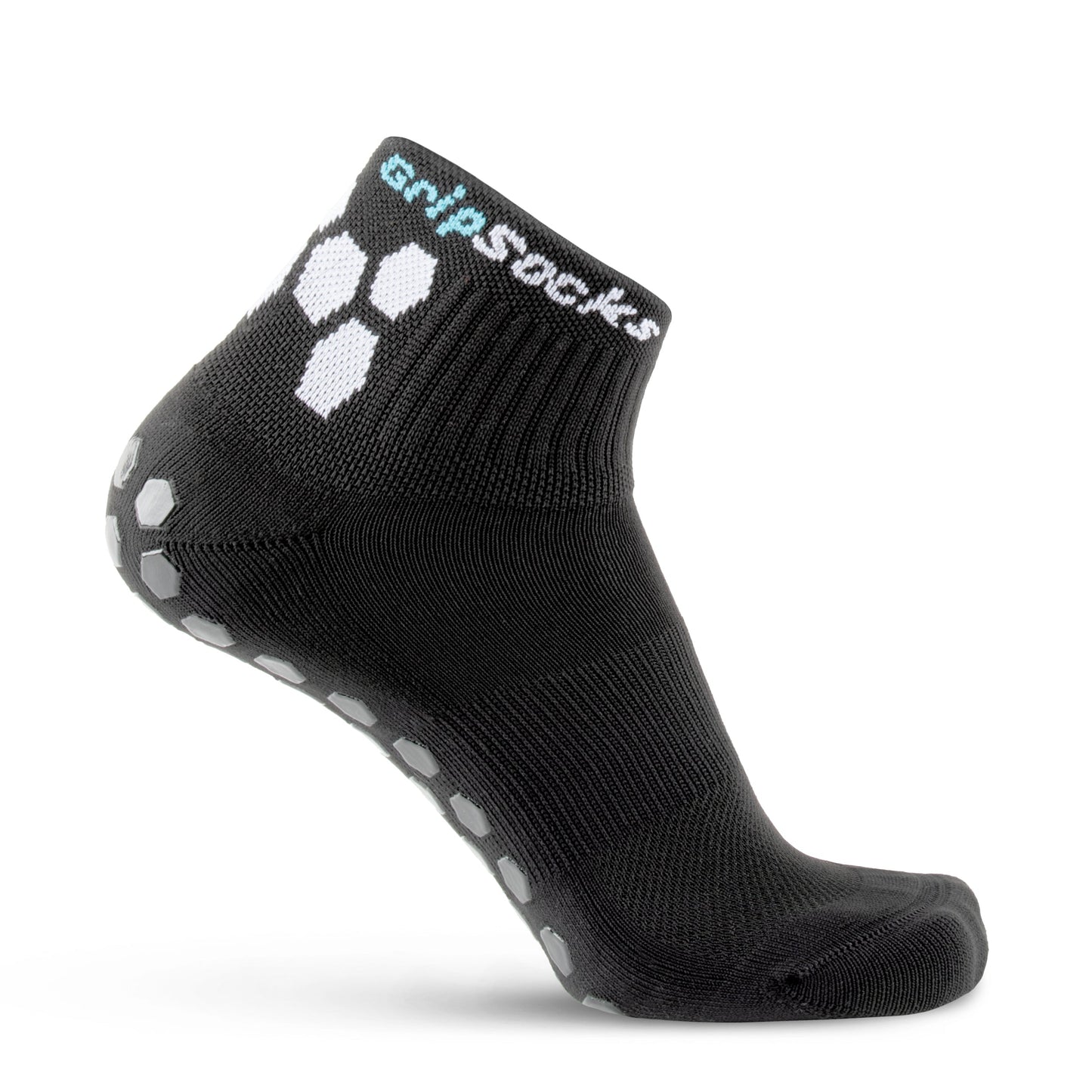 GripSocks Athletic Socks with Grips are black, feature white hexagonal grip patterns on the sole and side, and have "Grip Socks" text in white and blue on the ankle cuff. Displayed on a mannequin foot against a white background.