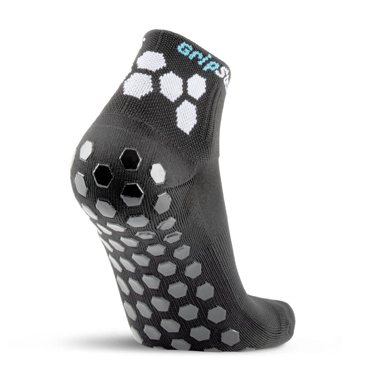 The GripSocks Athletic Socks with Grips - 1/4 Crew in black stands upright, showing its sole and heel, white hexagonal grip patterns, raised traction pads, anti-blister tech, and “GRIP” in white and light blue on the cuff.