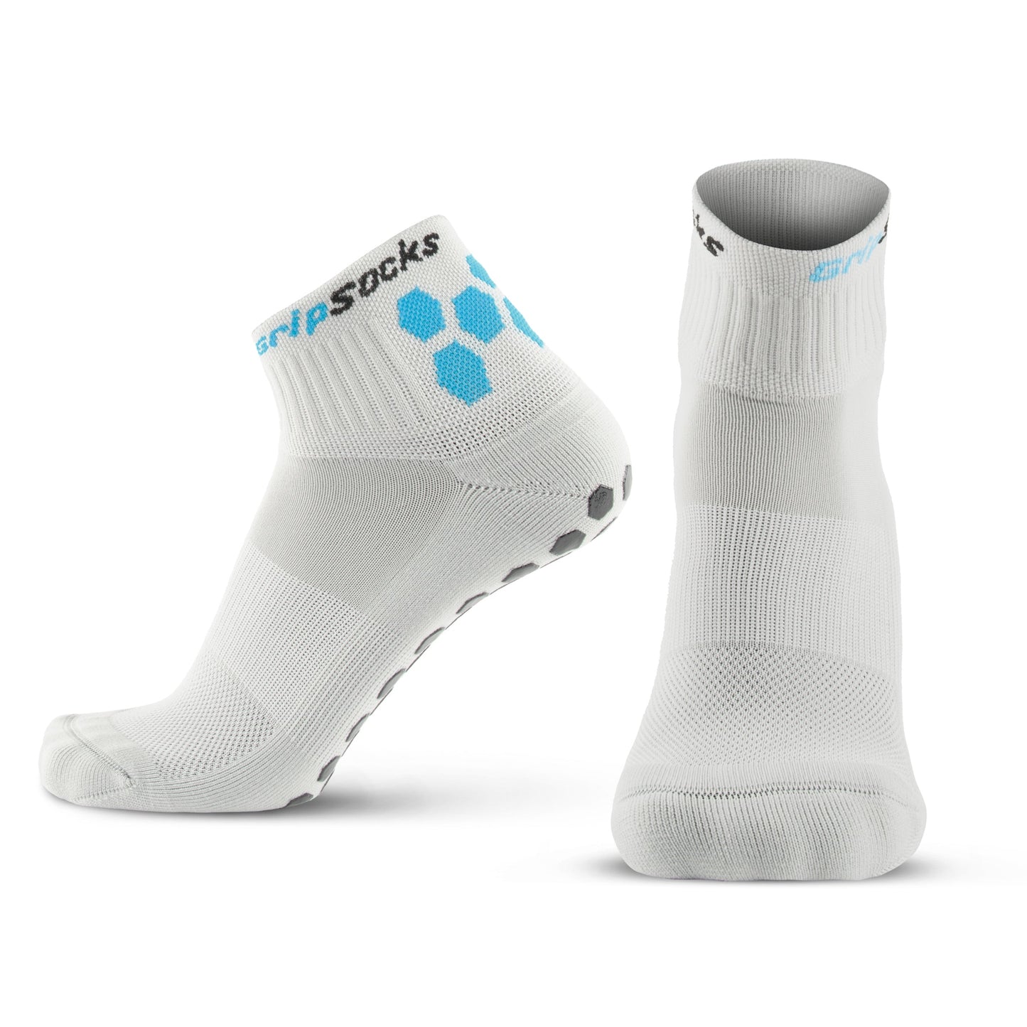 Two white Athletic Socks with Grips from GripSocks are shown: one upright showing the front, and one angled to reveal gray non-slip grips. Blue hexagons and "grip socks" decorate the cuff. Ideal anti-blister socks for sport or everyday use.