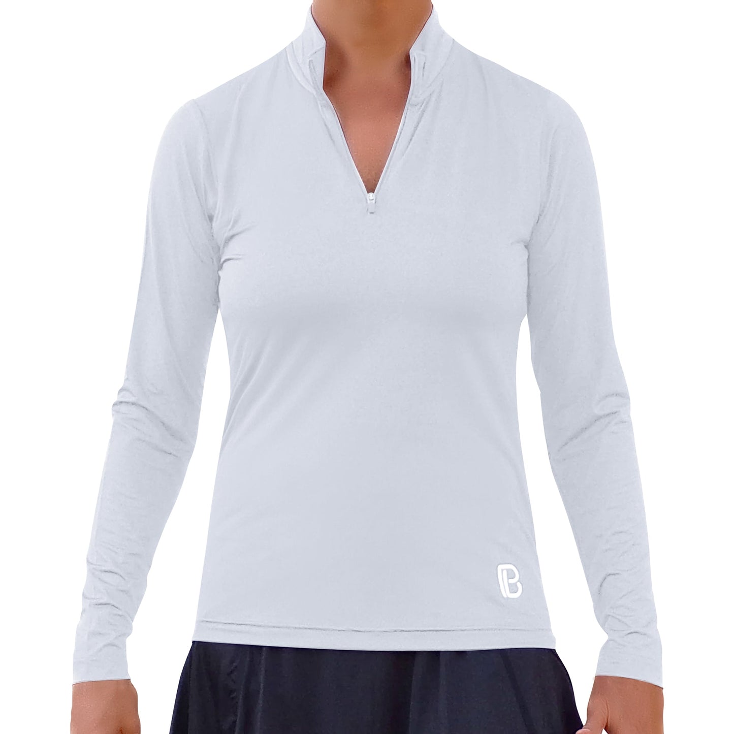 A person wears the Pickleball Bella PB 1/4 Zip Long Sleeve Classic White top, featuring SPF 50+ UV protection and a small lower-left logo, paired with a black skirt. The image is cropped at the neck and thighs with no background visible.