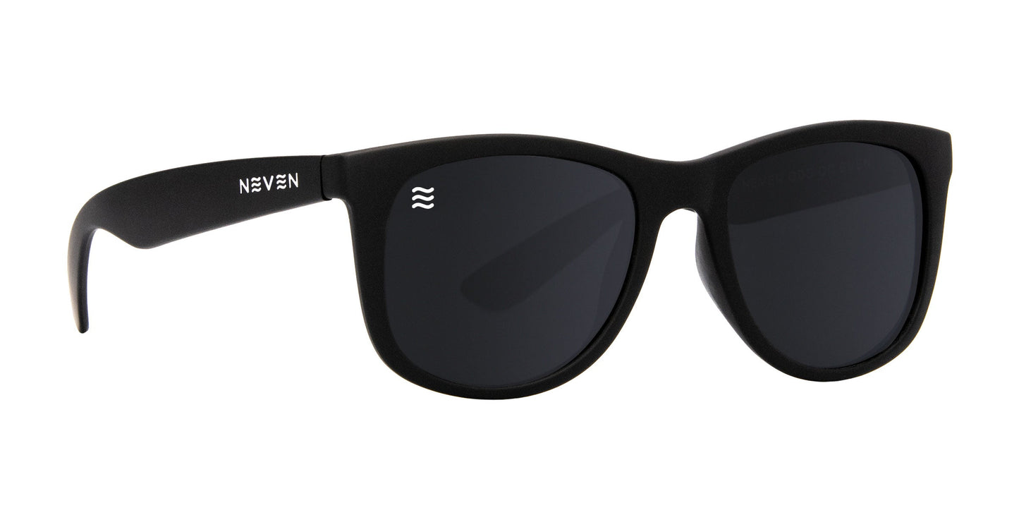 The Neven Eyewear Classic sunglasses feature a matte black frame, dark UV400 lenses, “NEVEN” in white on the left temple, and a small white wave logo on the upper corner of the left lens.