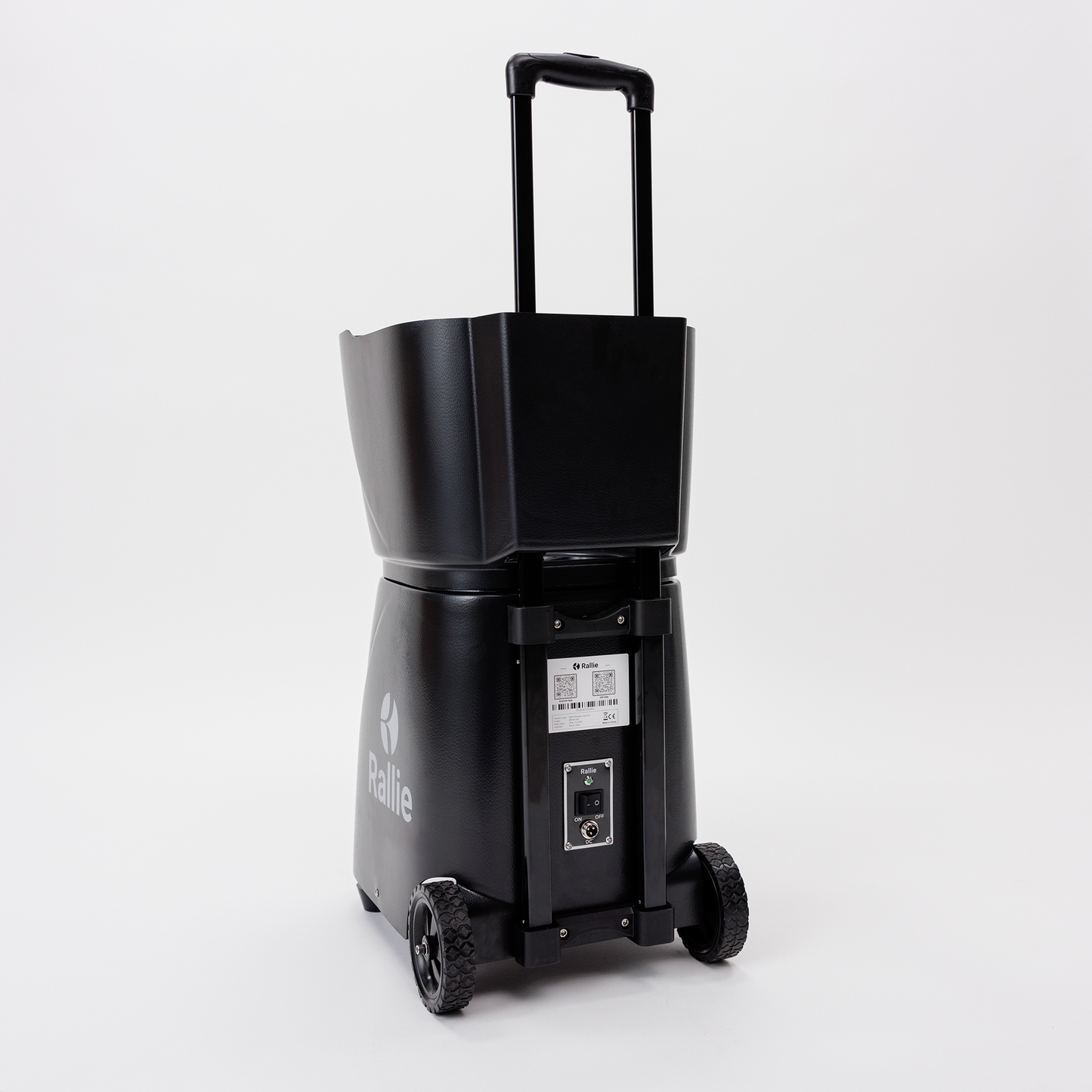 The Rallie Pickleball Machine - Midnight Black by Rallie Pickleball is a portable, wheeled machine with a telescoping handle, large open top compartment, and an electronic control panel above two rugged wheels, shown on a white background.