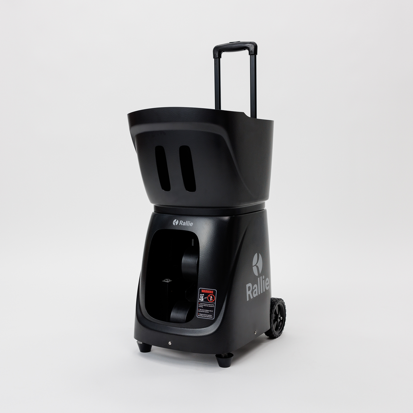 The Rallie Pickleball Machine - Midnight Black by Rallie Pickleball features a tall, upright design with wheels, a pull handle, large top hopper, and open lower compartment. The brand name appears on the side. Shown on a white background.