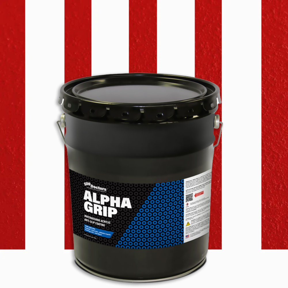 A large black bucket labeled SlipDoctors Alpha Grip Non-Slip Stripe and Athletic Court Paint sits on a white surface. The bucket features a metal handle, safety info, and blue-and-black geometric design; four vertical red stripes appear behind it.