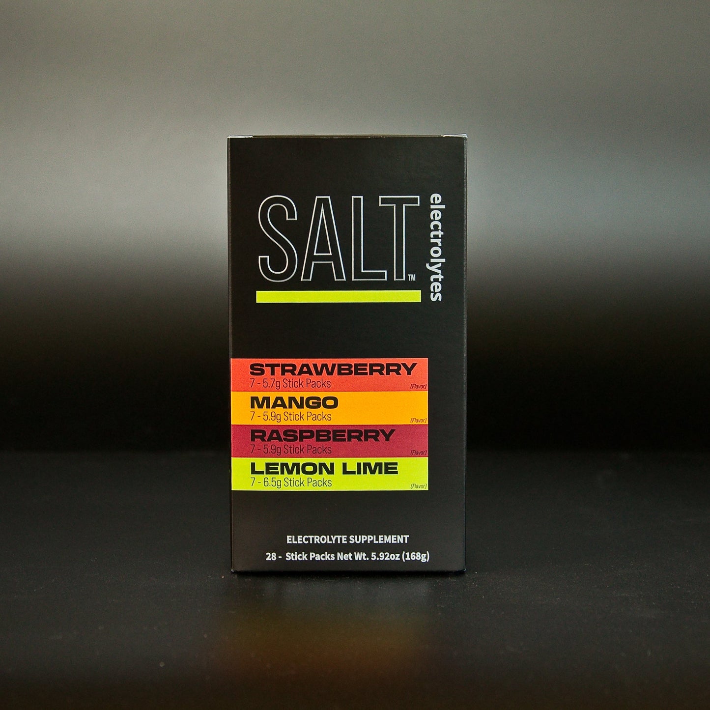 A black box of SALT Electrolyte Drink Mix Variety Pack by SALT Electrolytes stands upright against a dark background, showcasing bold colors for strawberry, mango, raspberry, and lemon lime. Includes 28 single-serving packets.