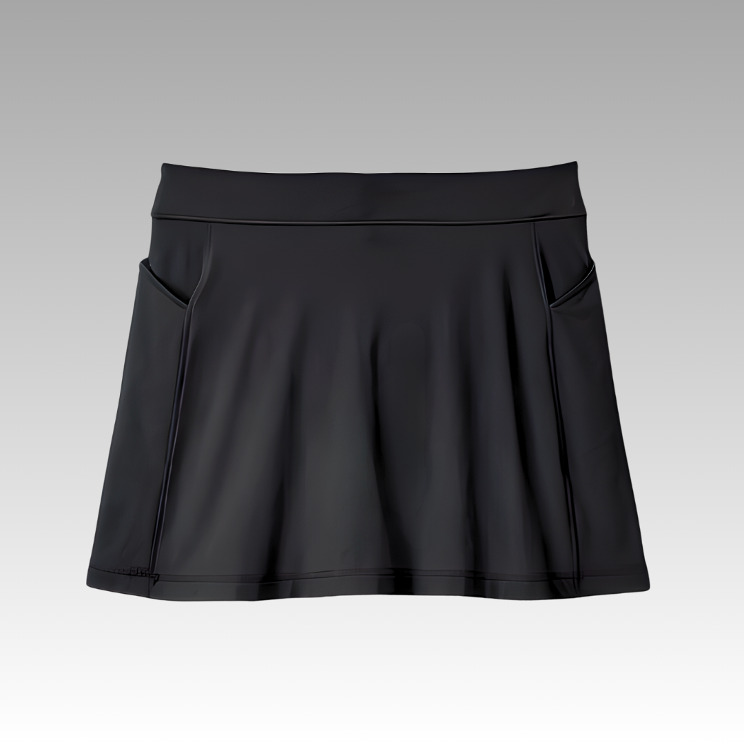 The Playly Store Sammy Skort 2.0 is a black, A-line athletic pickleball skort with a smooth finish, subtle sheen, two side pockets, and knee-length cut, shown against a light gray gradient background.