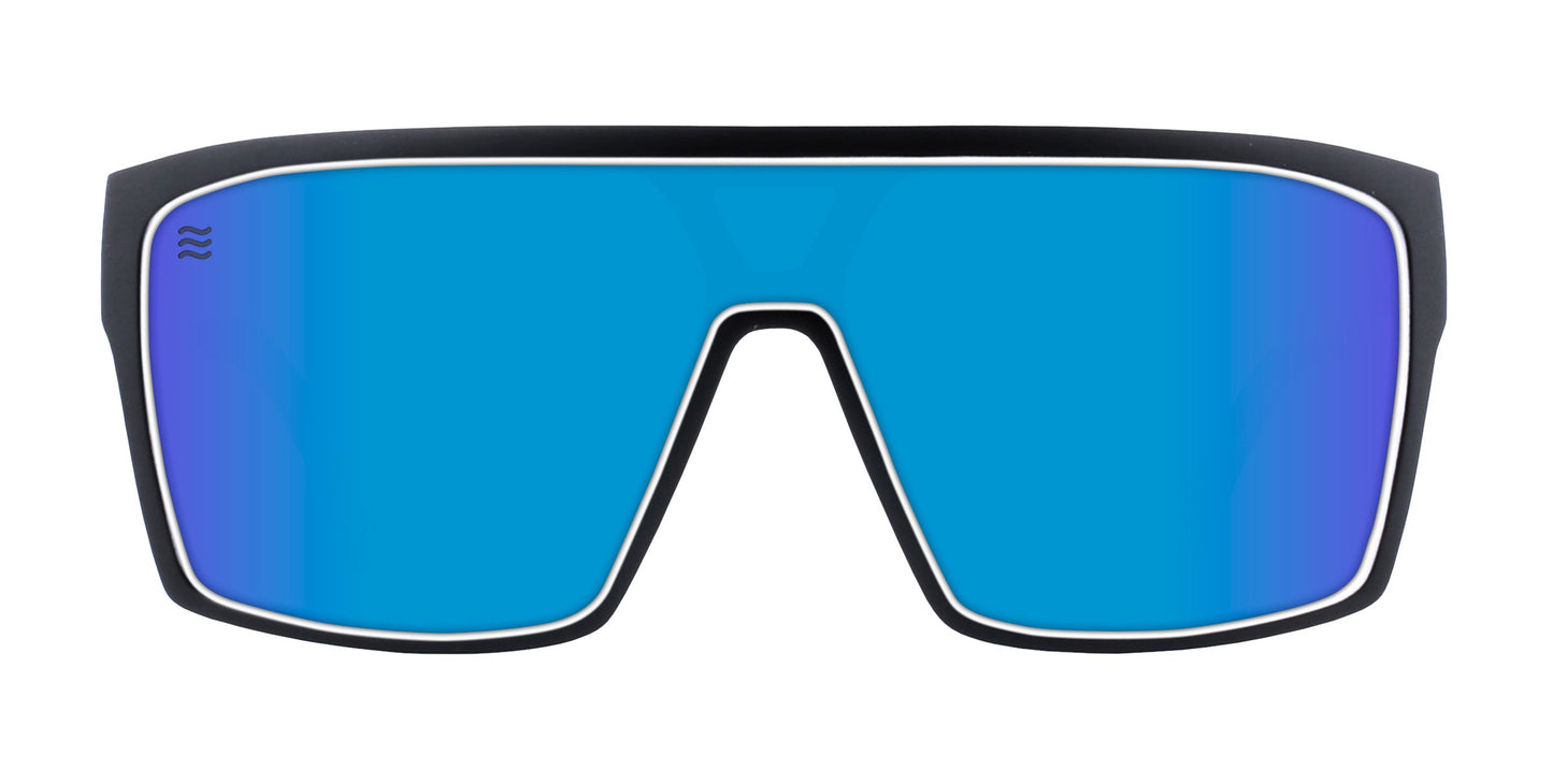 Neven Eyewear’s Spanish House sunglasses feature an oversized black frame, a single wide blue mirrored UV400 lens, and a wavy logo on the top left. Perfect post-surf eyewear with a futuristic look, shown on a plain white background.
