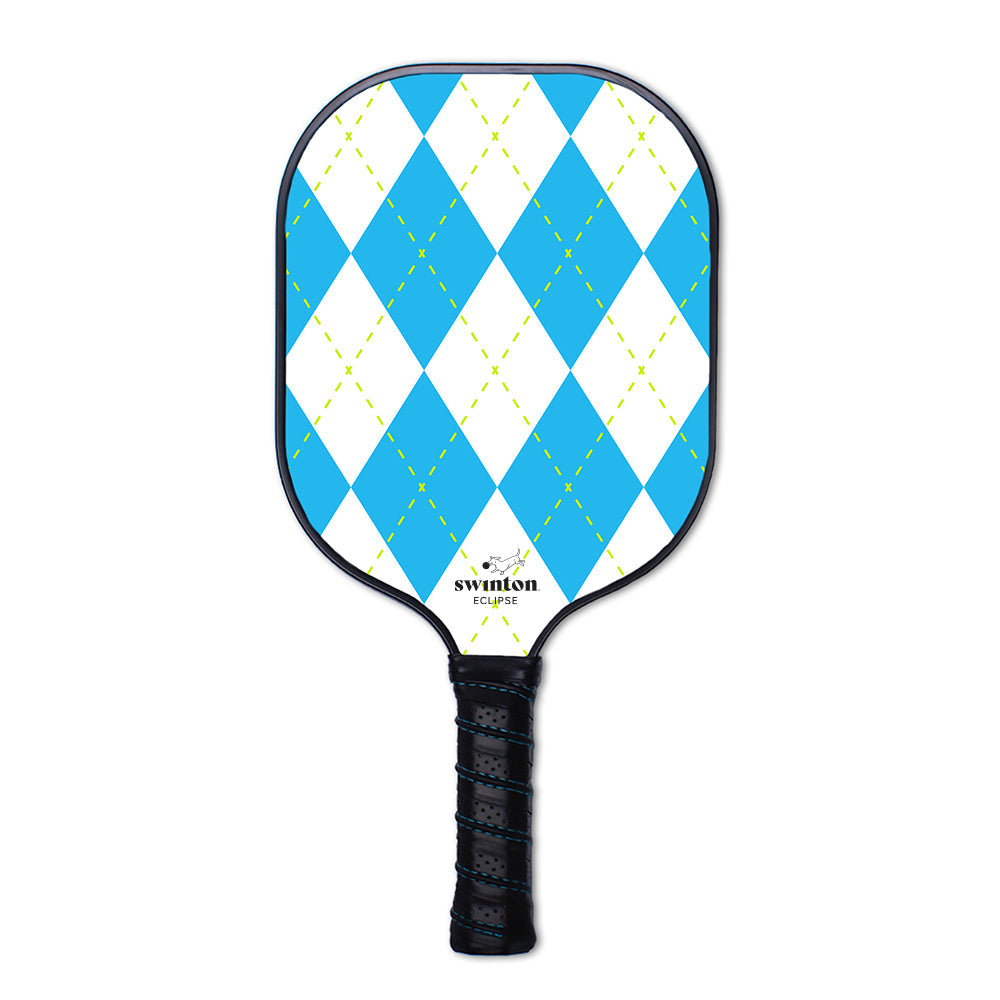 The Swinton Pickleball Eclipse Argyle Paddle features a black edge and handle, a textured graphite face with white and blue argyle diamonds crossed by green lines, and the Swinton Eclipse logo near the base. USA Pickleball approved.