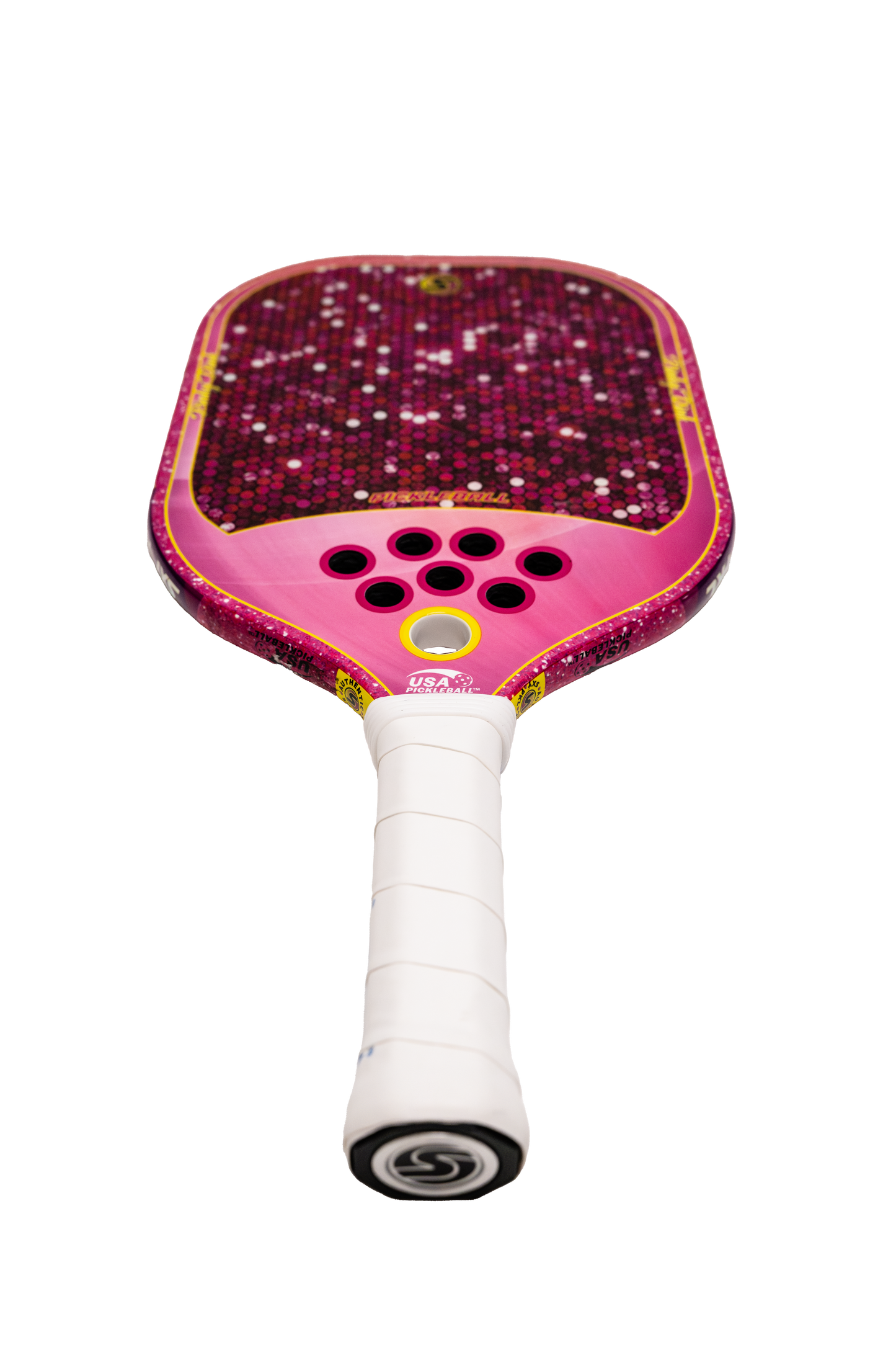 The SXY PKL Pinky Dink Pickleball Paddle by SEXY Brand features a pink and red carbon fiber face with a hexagonal pattern, five center holes, and a white grip. Its vibrant colors and modern design stand out against a plain white background.