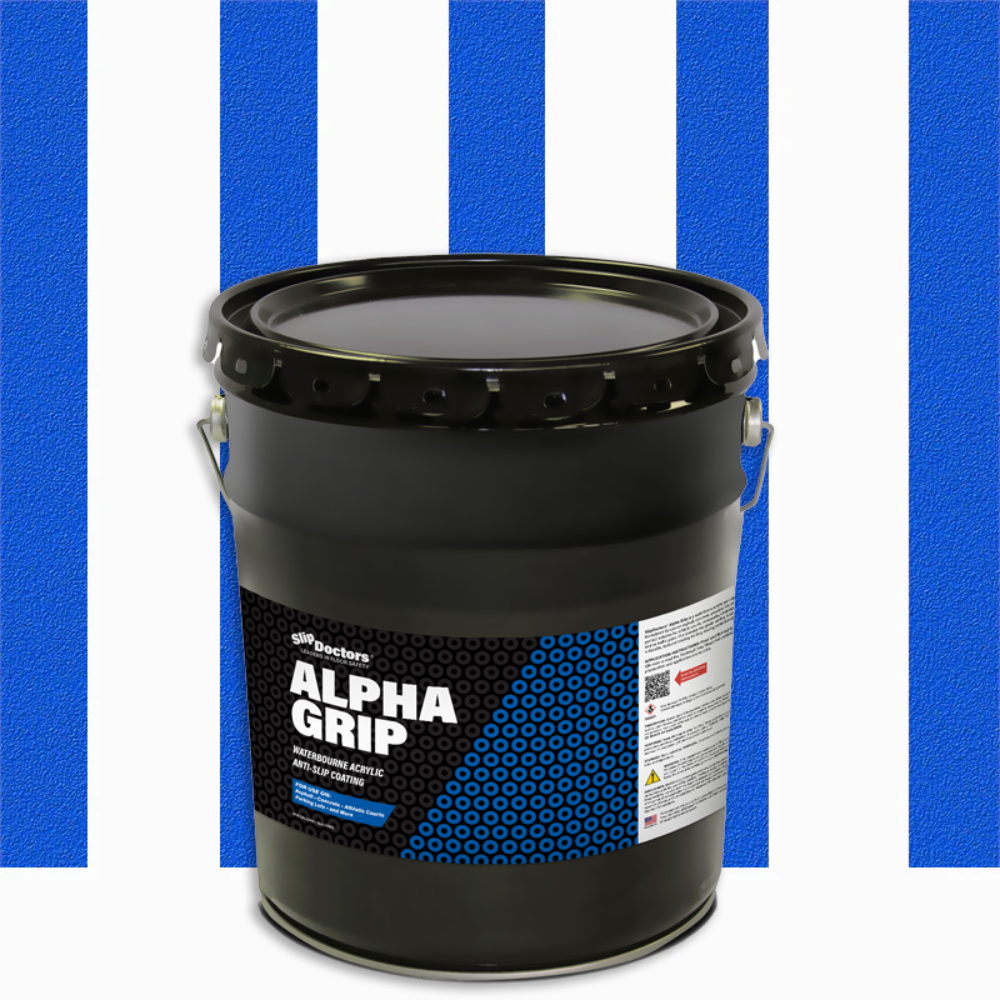 A large black pail labeled "Alpha Grip Non-Slip Stripe and Athletic Court Paint" by SlipDoctors features a blue hexagon pattern, instructional text, and sits in front of alternating blue and white stripes.
