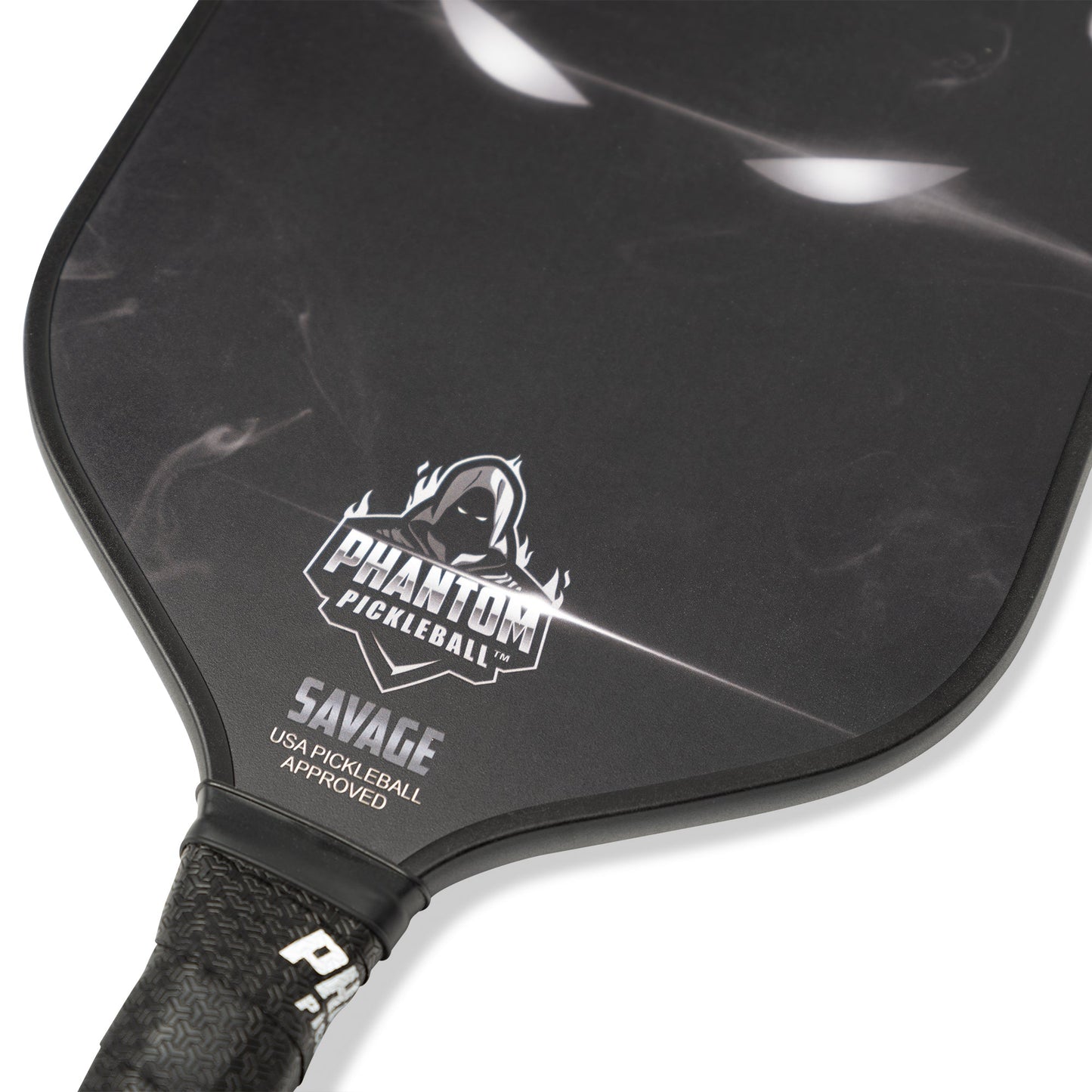 Close-up of the PHANTOM SAVAGE 13MM T800 Carbon Fiber Pickleball Pro Paddle by Phantom Pickleball, featuring the logo with a hooded figure, "SAVAGE" and "USA PICKLEBALL APPROVED" text, textured black grip, and subtle white highlights.