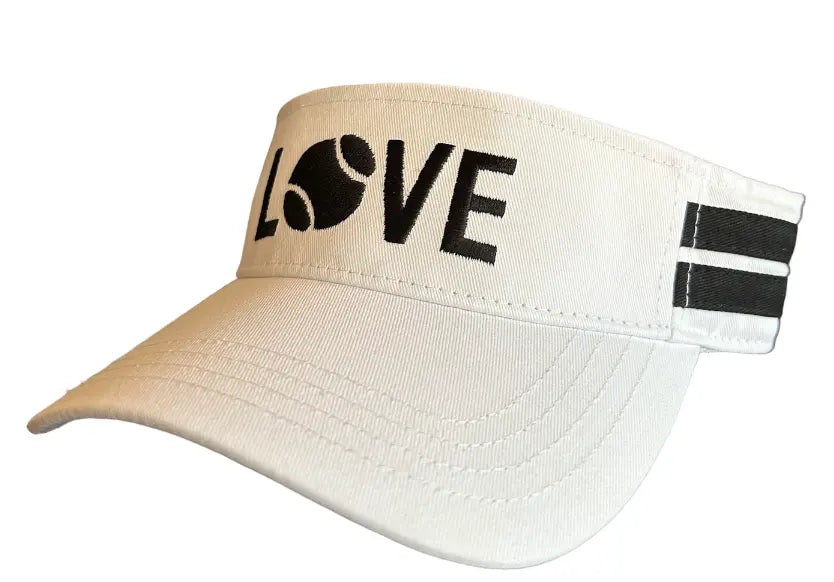 The Striped Cotton Canvas LOVE Visor by Runway Athletics features two black stripes on the adjustable strap, a curved bill, and "LOVE" in black with a tennis ball O for stylish sun protection. White cotton canvas; visible stitching.