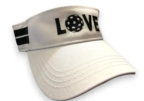 The Runway Athletics Pickleball Visor is a white, lightweight cotton canvas sun visor featuring black side stripes, "LOVE" with a pickleball on the front, a curved stitched brim, structured crown, and adjustable velcro strap for comfort.