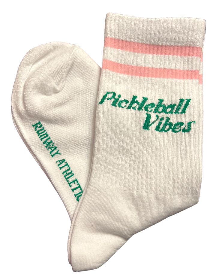 The Pickleball Vibes Socks - Pink/Green/White by Runway Athletics feature a sporty, retro design with ribbed cuffs, pink stripes, green "Pickleball Vibes" text on top, and "Runway Athletics" on the sole. Comfortable and stylish!.