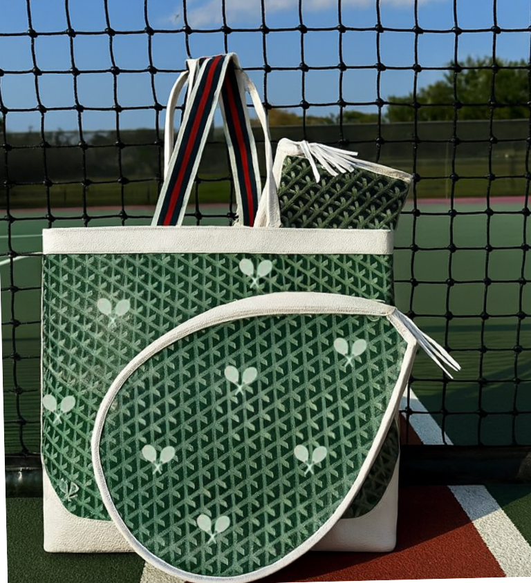 The Whimsy Tennis Bag - Boutique Vintage Vibe Green by Runway Athletics, with matching racquet cover and pouch, showcases a tennis racket pattern and white handles, displayed on court against a black net and blue sky.