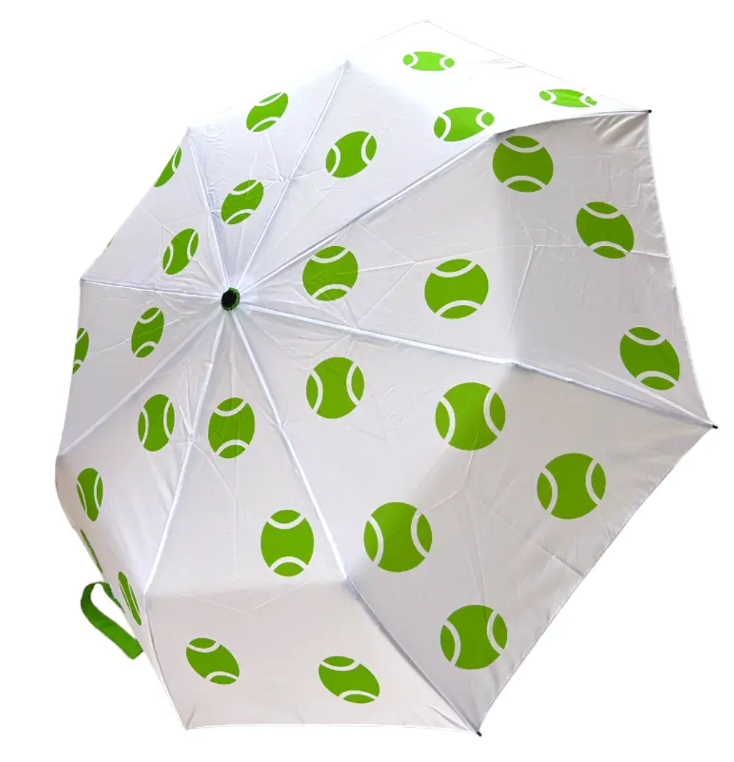 The Green with "Tennis" Envy - Gift Set by Runway Athletics features a white umbrella with green tennis ball patterns and an embroidered tennis hat—ideal as a gift or to elevate your courtside style.