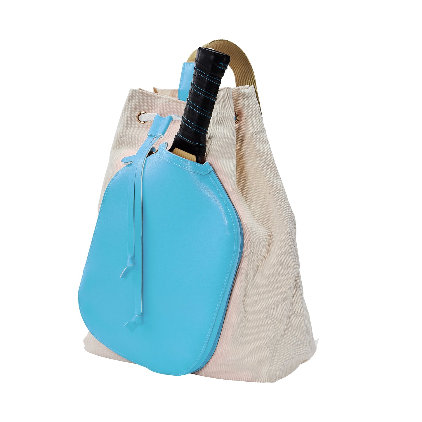The Pickleball Bella PB Neon Sky Blue Pickleball Drawstring Bag features cream canvas, a tan handle, a bright blue front pocket, and a top drawstring closure. A black-handled tennis racket is partly tucked in with the handle sticking out.