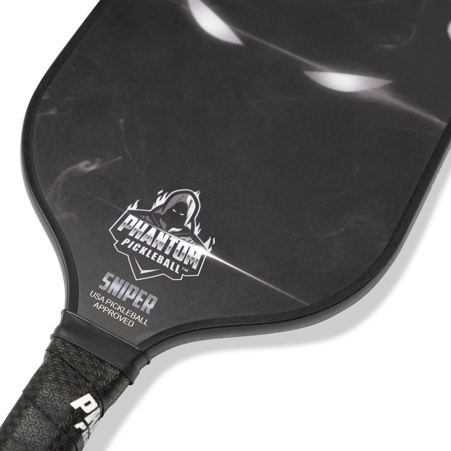 Close-up of the PHANTOM SNIPER 13MM T800 Carbon Fiber Pickleball Pro Paddle by Phantom Pickleball, showing its textured grip, hooded figure logo, and subtle shadowy face design from the Power and Precision Series. USA PICKLEBALL APPROVED.