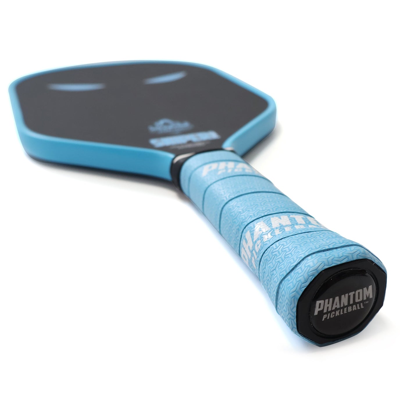 Close-up of the PHANTOM SNIPER PRO 12MM T700 Raw Carbon Fiber Paddle by Phantom Pickleball features a blue and black design, textured blue grip labeled “PHANTOM PICKLEBALL,” and sleek rounded edges from the Advanced Response Series.
