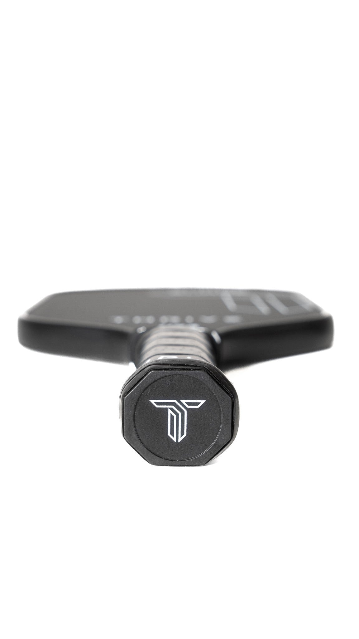 Close-up of the Thrive Pickleball Surge 16 MM (ALL COURT SERIES) paddle, featuring a black grip with a white horned logo, metallic shaft, carbon fiber head with subtle white accents. Includes lead weights, eraser, key chain & weight card.