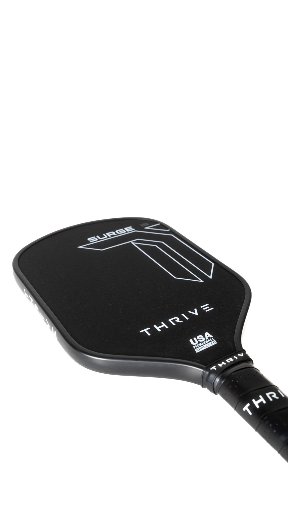 The Surge 16 MM paddle from Thrive Pickleball features a black carbon fiber build, geometric design, and textured grip. "USA Pickleball Approved" is printed below. Shown on white background, it includes lead weights, eraser, keychain, and weight card.