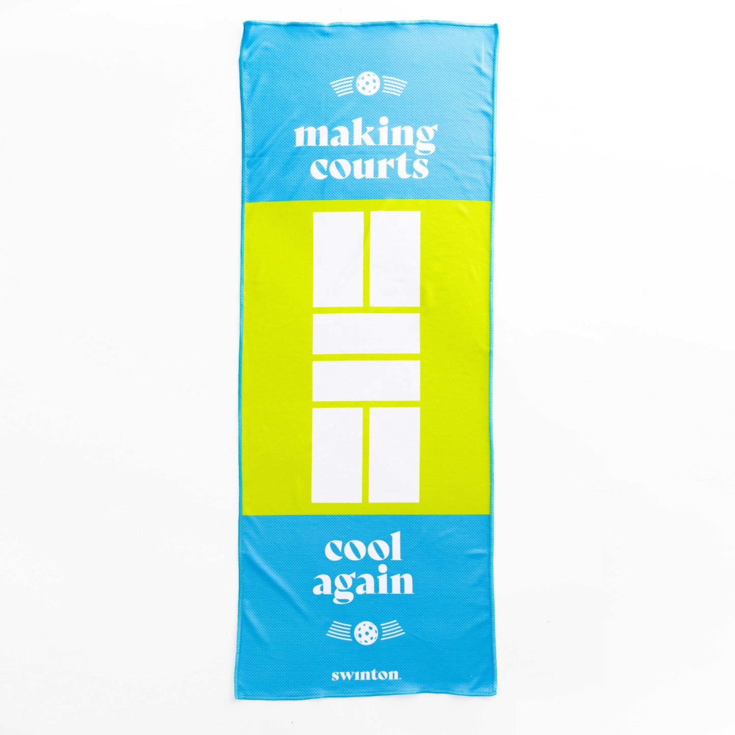 The Swinton Pickleball Court Cooling Towel features a blue background, a yellow pickleball court design, white geometric lines, and the phrases “making courts cool again” and “swinton.”.