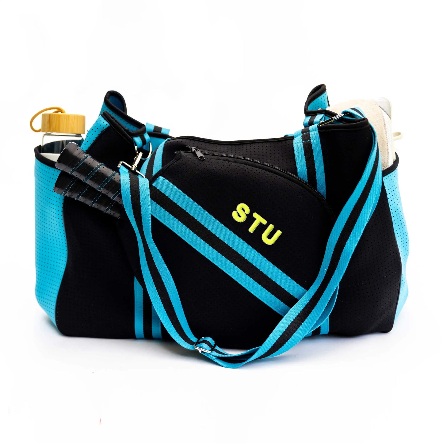 The Swinton Pickleball XL Pickleball Tote Bag - Black (XL) features blue stripes, yellow "STU" letters, an adjustable blue-striped strap, a front zip pocket, side pockets for a water bottle and towel, and holds two tennis racket handles.