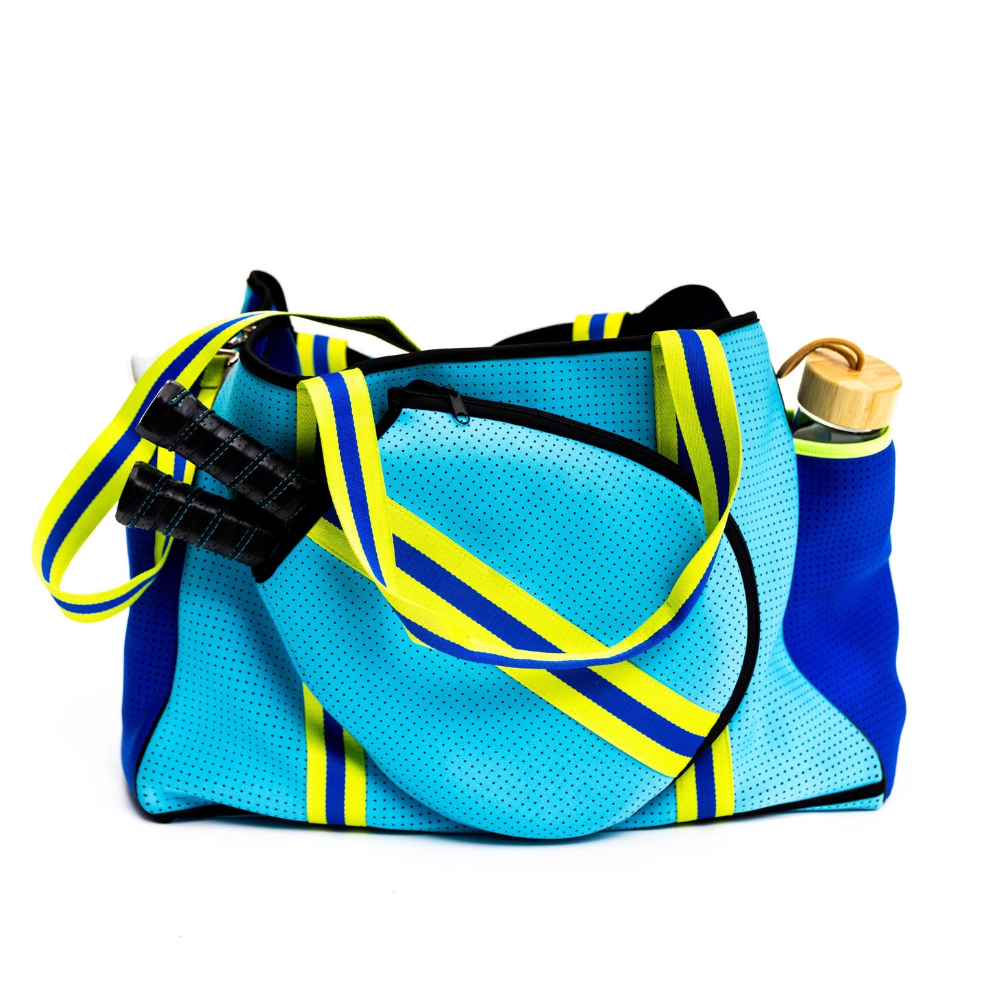 The Swinton Pickleball XL Pickleball Tote Bag in blue features yellow and green striped straps, a matching pouch, black handles, and a water bottle in the side pocket, all displayed on a white background.