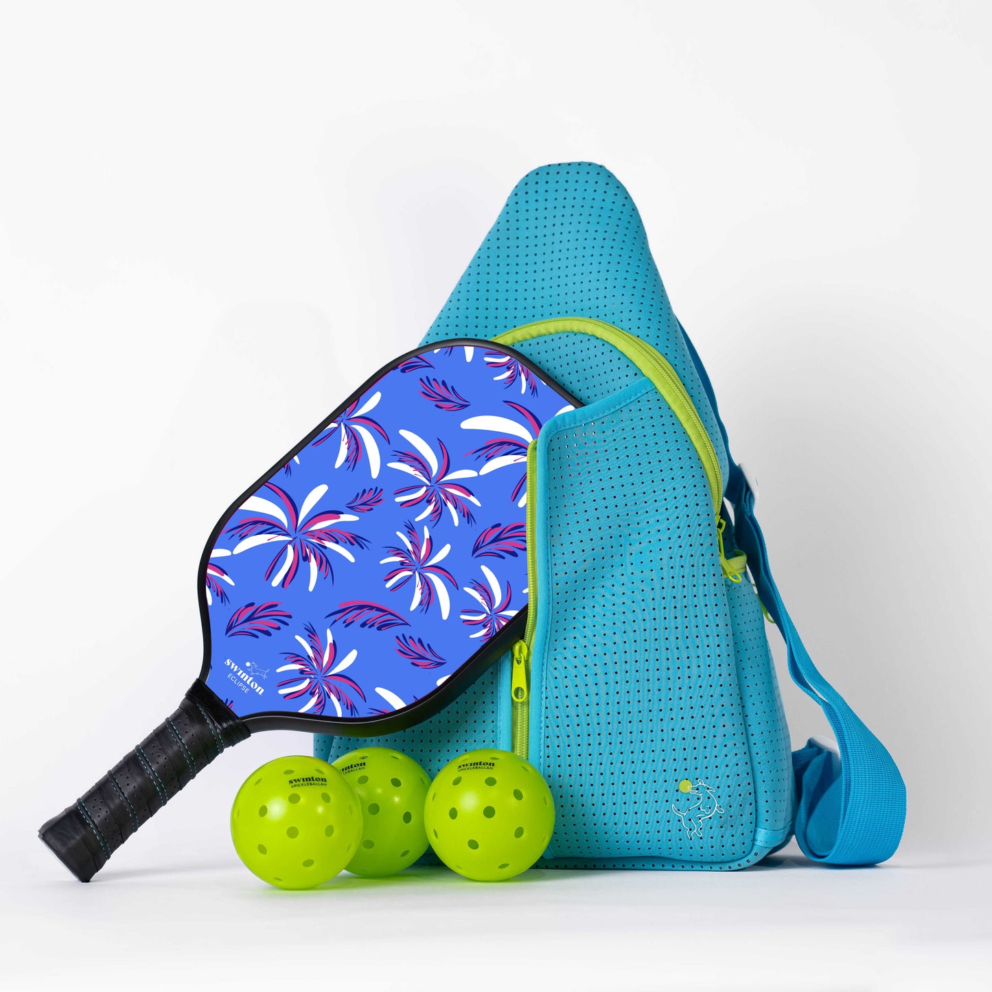 The Swinton Pickleball Starter Bundle - Blue features a blue sports bag, stylish paddle, and three neon yellow pickleballs—everything you need for pickleball, all arranged on a white surface.