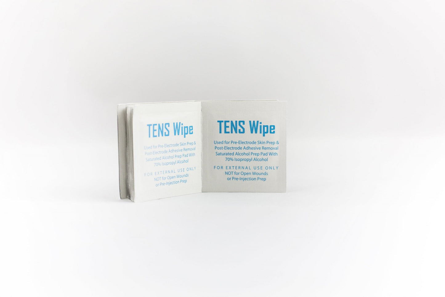 A small packet labeled “TENS Prep Wipes” by iReliev sits open on a white background. Blue-lettered instructions note its use for electrode skin prep, aiding electrical impulse dispersion, and specify it is for external use only.