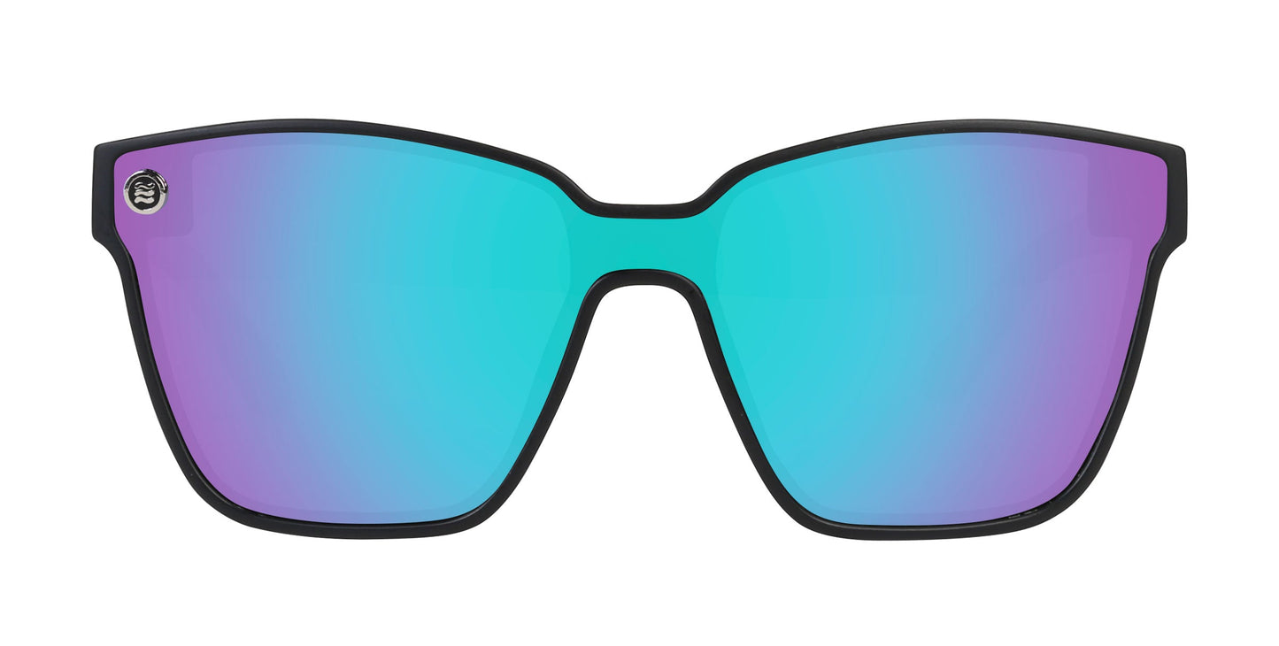 The Curiosity sunglasses by Neven Eyewear feature a matte black frame, large rectangular lenses with a turquoise-purple gradient reflective tint, and a small circular metallic logo on the top left corner.