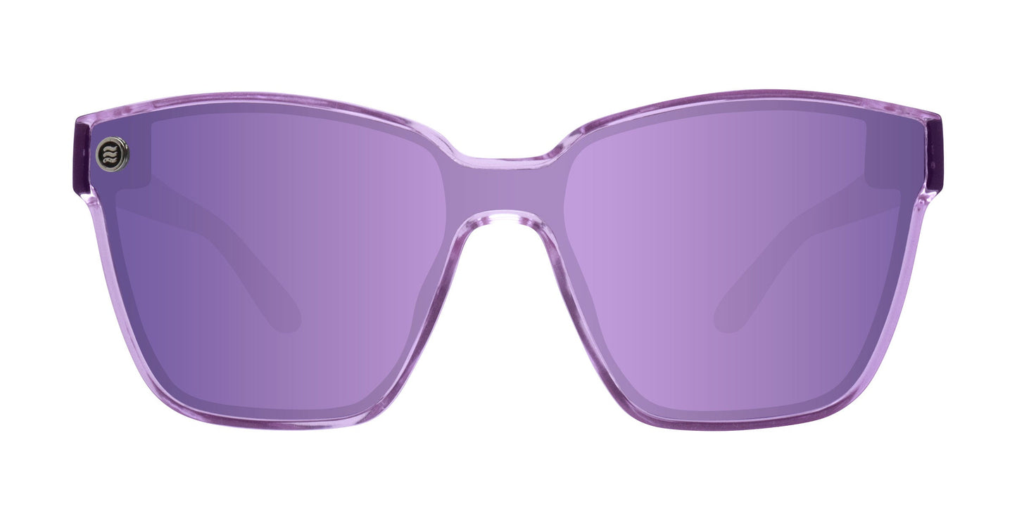 Front view of Neven Eyewear’s Discovery sunglasses with translucent purple rectangular frames, matching tinted lenses, polarized UV400 protection, and a small circular metallic logo on the upper left of the left arm.
