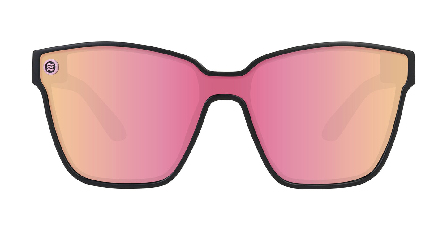 Neven Eyewear Endeavour sunglasses feature a black frame, large square lenses with a pink-orange gradient tint, polarized UV400 protection for clarity, and durable stainless steel hinges. Displayed against a plain white background.
