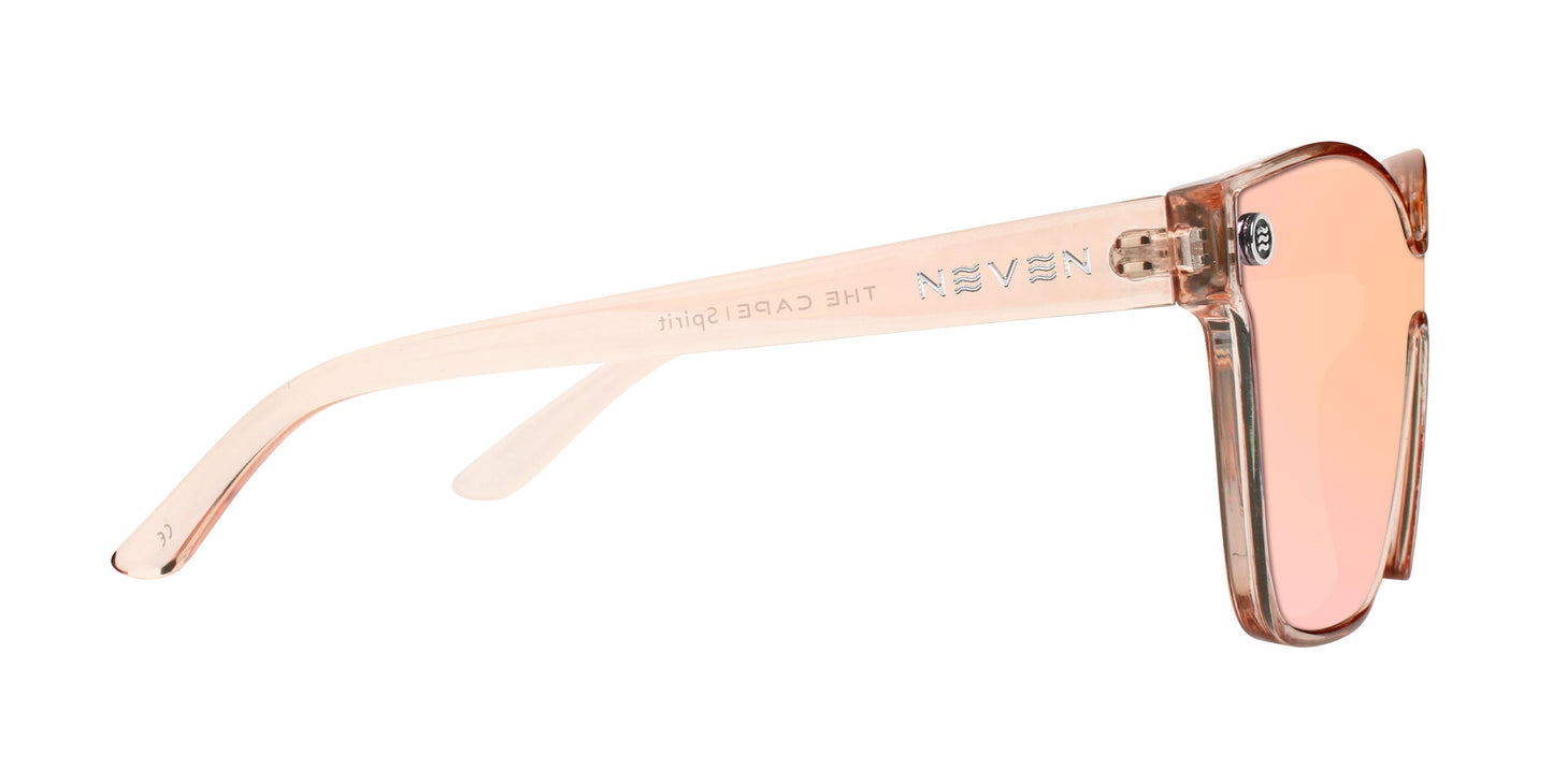 Side view of Neven Eyewear’s Spirit sunglasses with transparent peach-pink frames, polarized UV400 mirrored champagne gold lenses, and glossy finish. "NEVEN" and "THE CAGE FIGHT" appear in silver text on the arm.