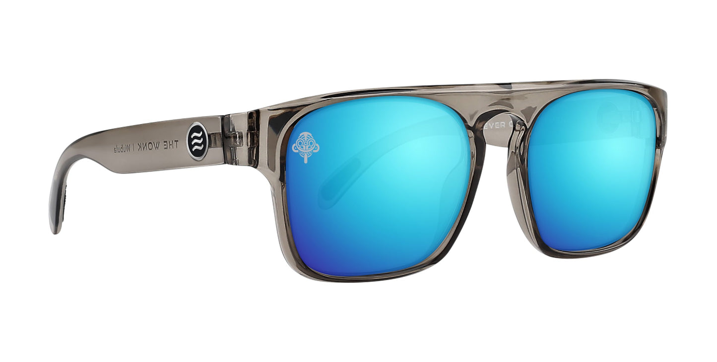 A pair of Wubula polarized sunglasses by Neven Eyewear with a transparent gray plastic frame, vibrant blue mirrored lenses, and modern rectangular shape. The arms feature a white circular logo and “Neven Eyewear” in black.