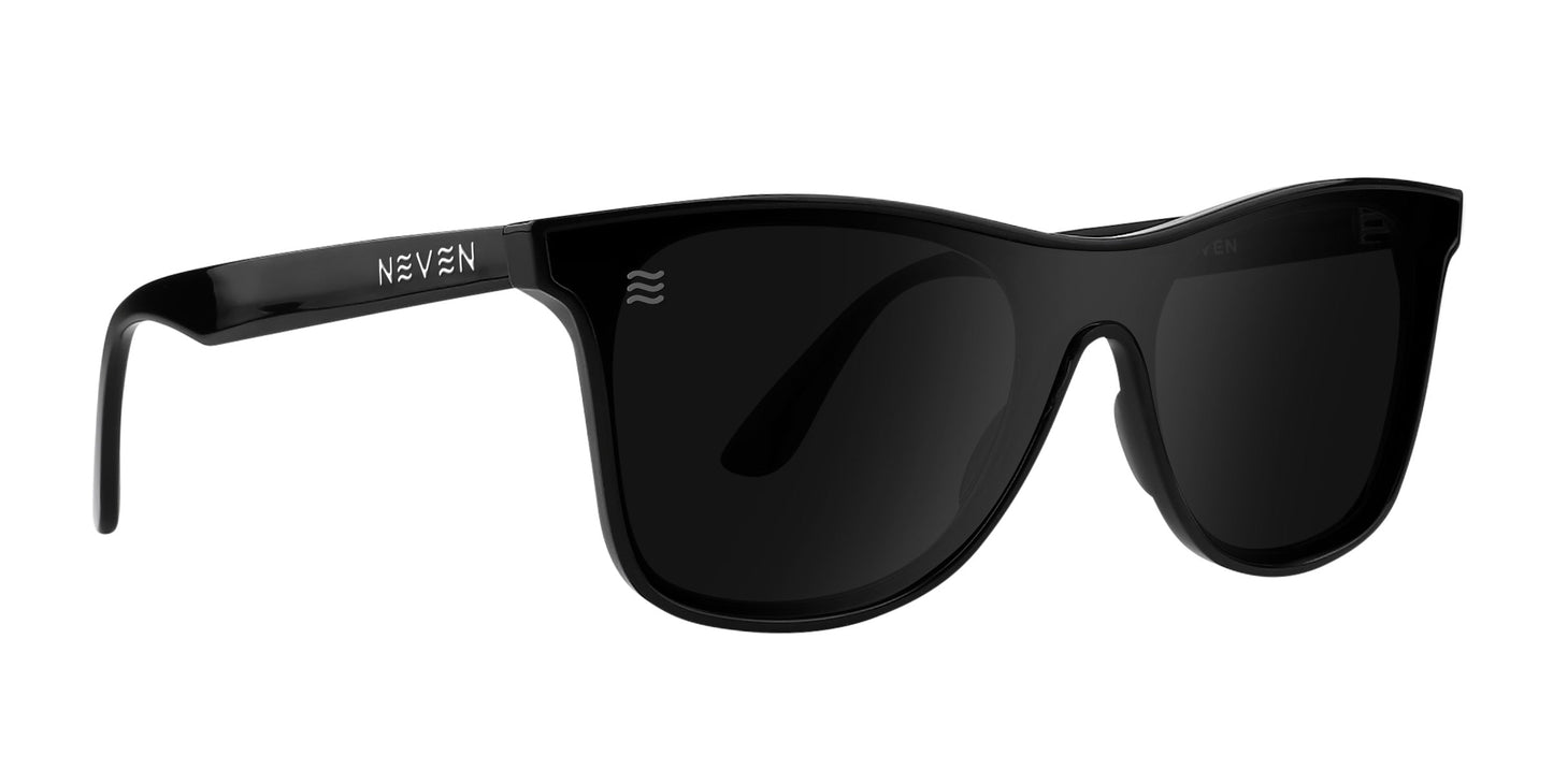 The Goblin sunglasses by Neven Eyewear feature black polarized lenses, a glossy finish, thick frames, and a modern angular design. Part of the Thestral Collection, the left arm displays “NEVEN” in white text.