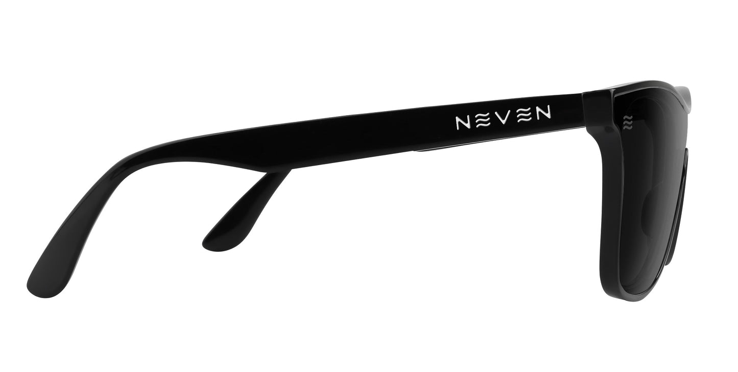 A close-up side view of Goblin black polarized sunglasses from Neven Eyewear, featuring thick arms and a bold white Neven logo on the temple. The glossy frames pop against a white background, showcasing their sleek finish.