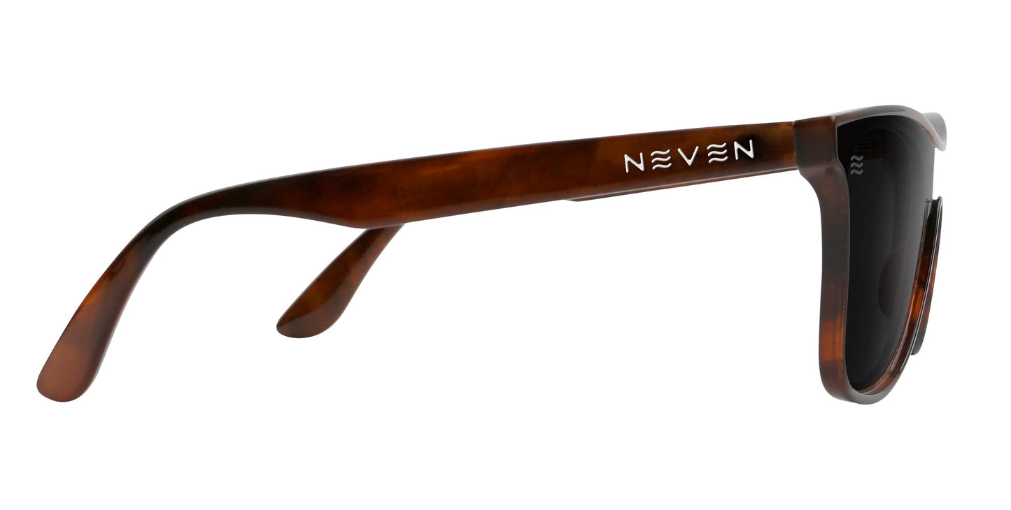 Warlock sunglasses by Neven Eyewear in brown tortoiseshell, shown side-on. Features a glossy, classic curved frame, black polarized UV400 lenses, and "NEVEN" printed in white on the temple arm.