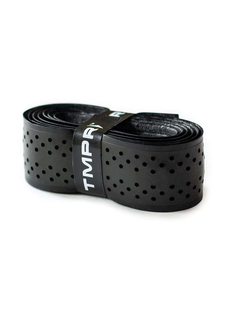 The TMPR Replacement Grip by TMPR Sports is a black, coiled handlebar tape with evenly spaced perforations and a smooth, glossy finish, secured by a black TMP-branded band—ideal for cushioned grip replacement.