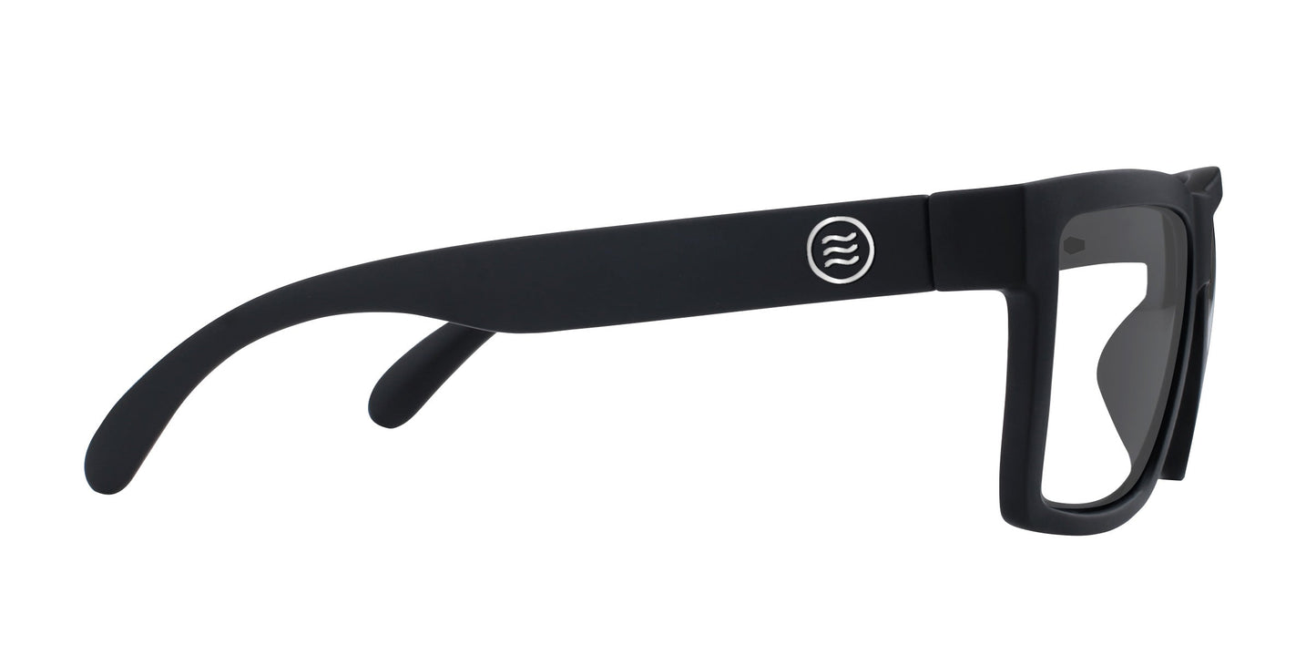 The Neven Eyewear Malibu XL sunglasses feature thick black frames, dark-tinted lenses, and a circular logo on the arm. These sporty, prescription-ready shades are ideal motorcycle riding eyewear.