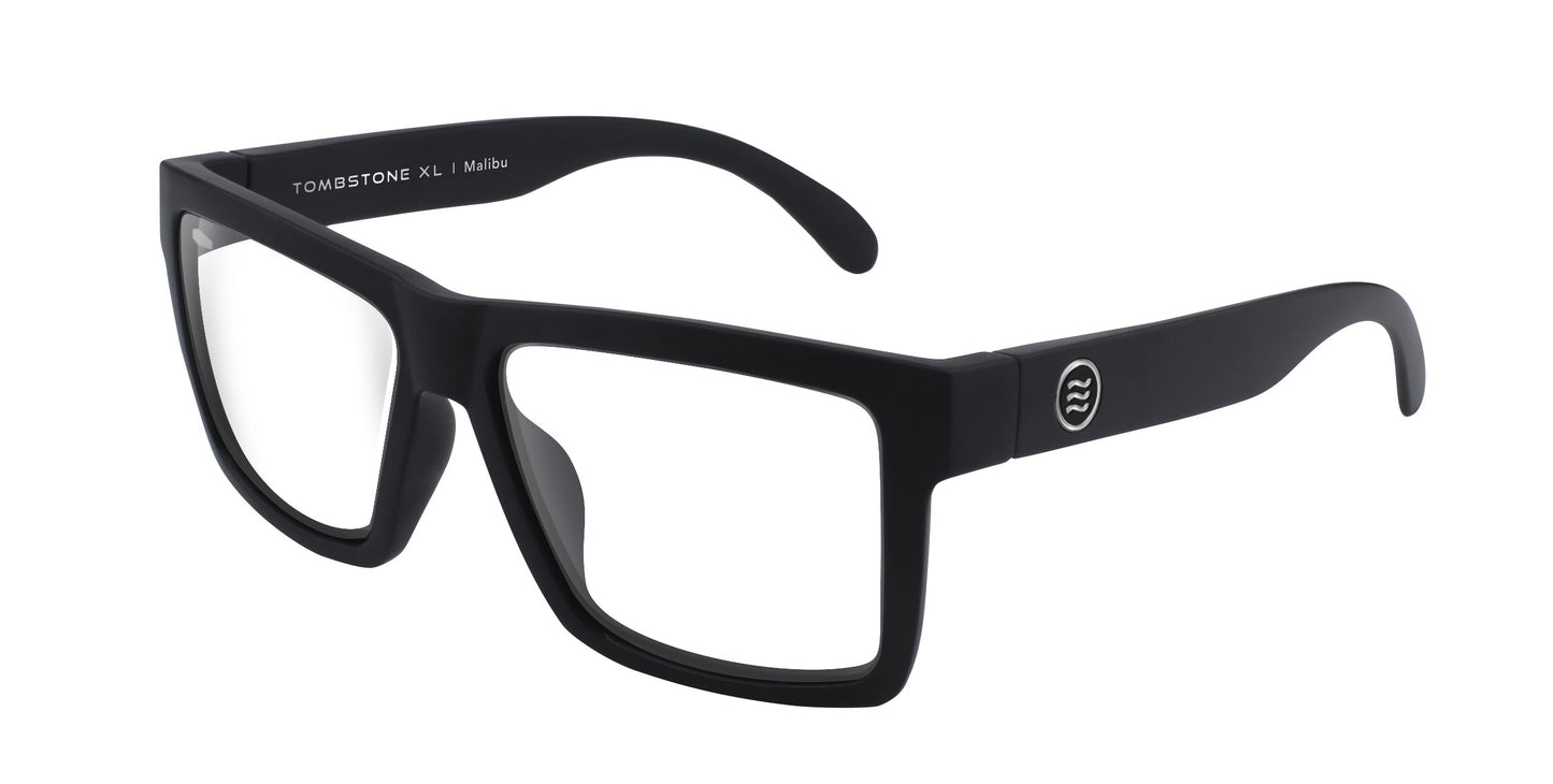 Matte black rectangular eyeglasses, Malibu XL by Neven Eyewear, with clear lenses and thick frame for motorcycle riding. Features a small circular logo with two wave lines on the temple. “MALIBU XL | Matte” printed inside arm. Shown on white background.