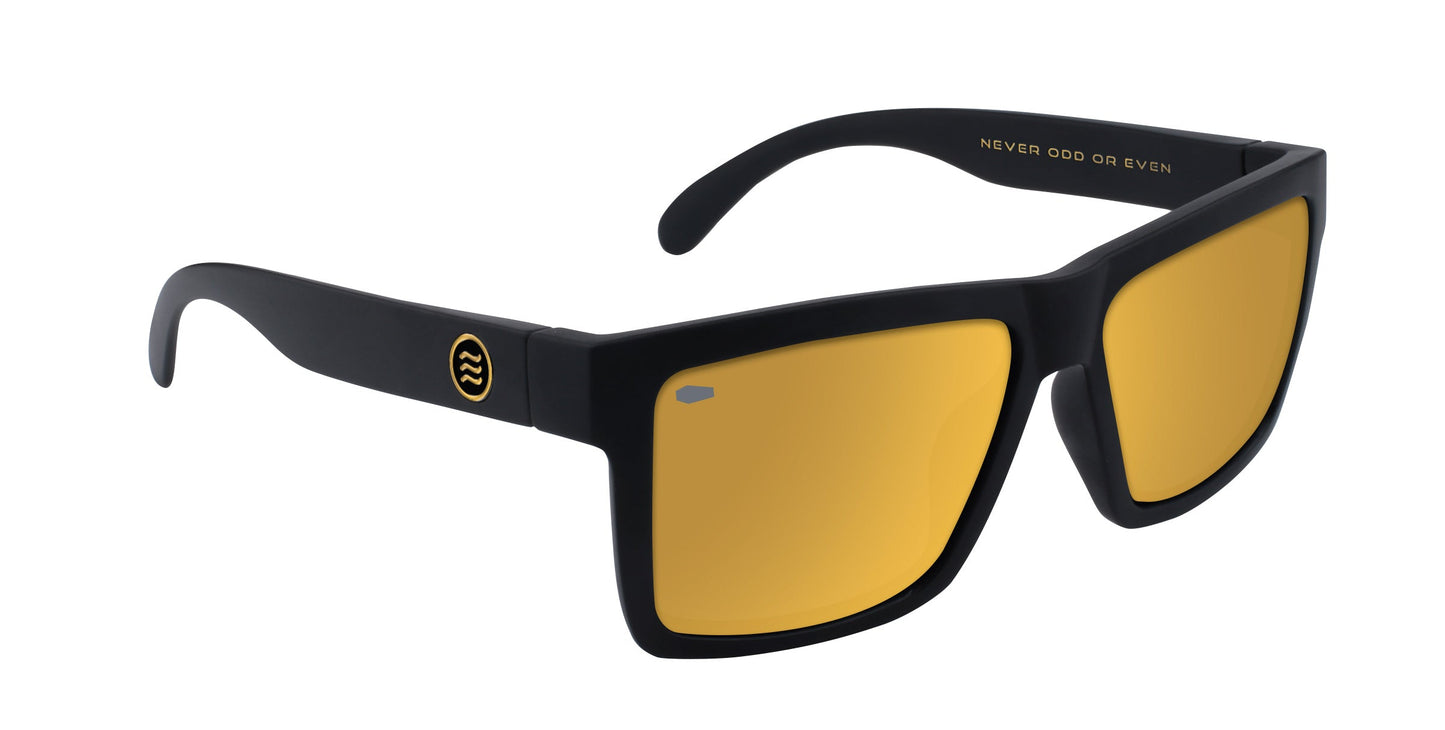 Neven Eyewear's Sentry XL sunglasses feature a bold matte black frame and rectangular polarized gold lenses. "NEVER ODD OR EVEN" is printed inside the temple with a small circular logo by the hinge, set on a white background.